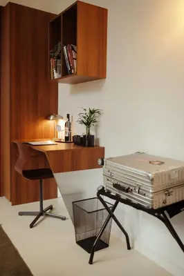 a room with a desk and a suitcase on a table at A Place - Boutique Hotel - Meir 24 in Antwerp