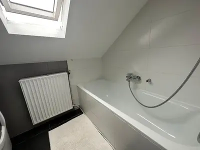 a bathroom with a shower and a bath tub at Charming Entire Apartment in Saint-Gilles, Brussels in Brussels
