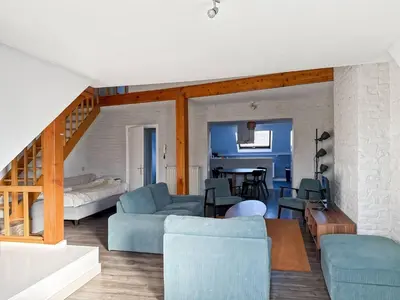 a living room with a couch and a table at Charming Entire Apartment in Saint-Gilles, Brussels in Brussels