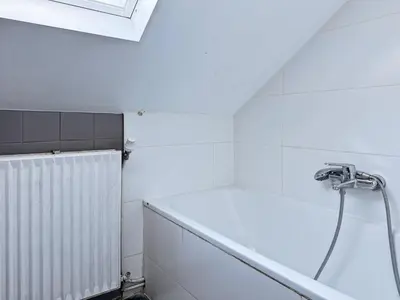 a white bathroom with a shower and a sink at Charming Entire Apartment in Saint-Gilles, Brussels in Brussels