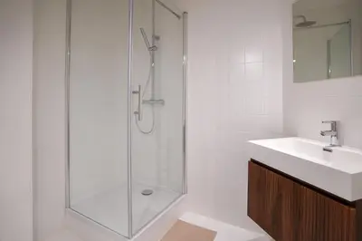 a bathroom with a shower and a sink at Schuman 2 in Brussels