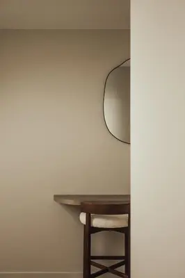 a room with a table and a mirror on the wall at LEO - Antwerp in Antwerp