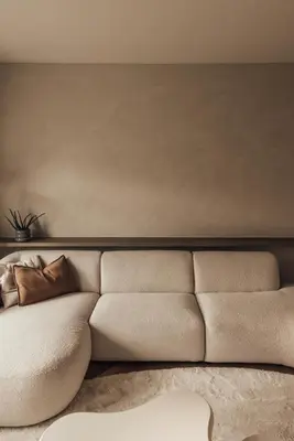 a living room with a couch in front of a wall at LEO - Antwerp in Antwerp