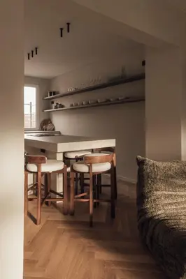 a living room with a table and chairs and a couch at LEO - Antwerp in Antwerp