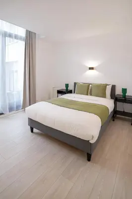 a bedroom with a large bed in a room at Jourdan 4 in Brussels