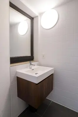 a bathroom with a white sink and a mirror at La Chasse 5 in Brussels