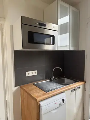 a kitchen with a sink and a microwave at Appartement Brussels Expo II in Grimbergen