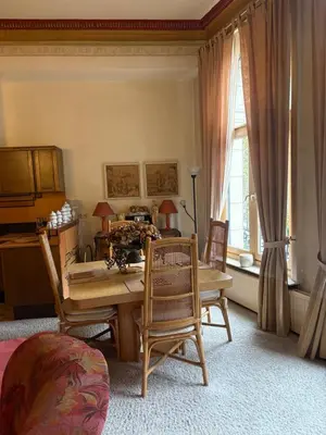 a dining room with a table and chairs at Charming apartment in Antwerp in Antwerp