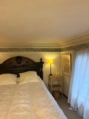 a bedroom with a bed and a table with a lamp at Charming apartment in Antwerp in Antwerp