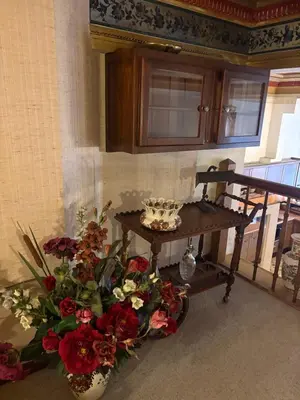 a table with a bunch of flowers in a room at Charming apartment in Antwerp in Antwerp