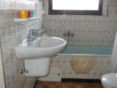 a bathroom with a sink and a toilet at Bij het station van Drongen in Ghent