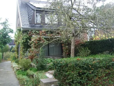 a house with a garden in front of it at Bij het station van Drongen in Ghent