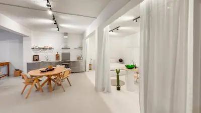 a kitchen and dining room with a table and chairs at Modern loft near City Centre, Nomade CasaMia in Antwerp