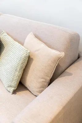 a white couch with two pillows on it at Spacious 7-Person House in the Heart of Antwerp in Antwerp