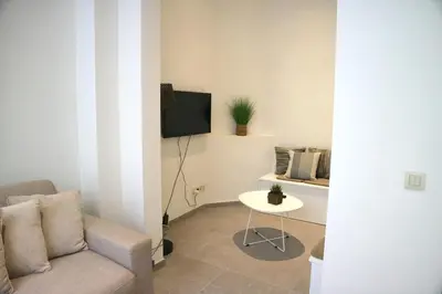 a living room with a couch and a table at Spacious 7-Person House in the Heart of Antwerp in Antwerp