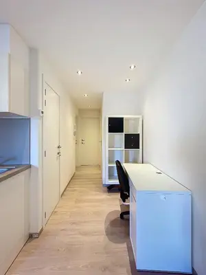 an office with a white desk and a chair at kazernestraat app 101 in Ghent