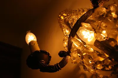 a lamp with a candle on a wall at Casa Lucinda in Ghent
