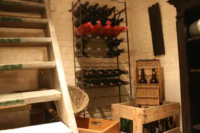 a wall with a rack of wine bottles at Casa Lucinda in Ghent