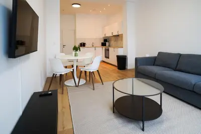a living room with a couch and a table at Appartment Astrid 4 in Brussels