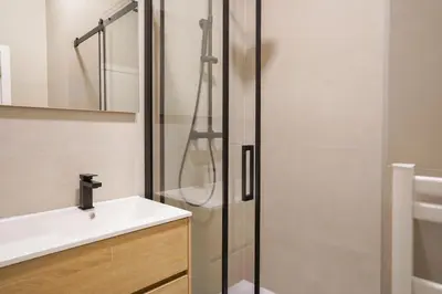 a bathroom with a sink and a shower at Appartment Janson 5 in Brussels