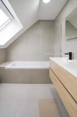 a bathroom with a sink and a bath tub at Appartment Douvres 7 in Brussels