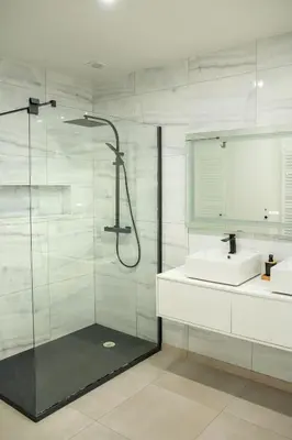 a bathroom with a shower and a sink at Brussels South - Cosy Appartment in Brussels