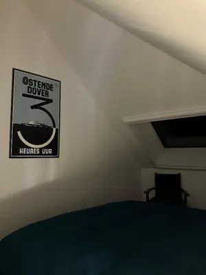 a sign on a wall above a bed in a room at Tampico, Holiday Home at river Schelde in Hamme