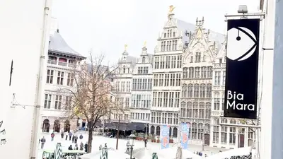 a group of buildings on a city street with a sign at NEW Central old town - Exclusive Residences in Antwerp
