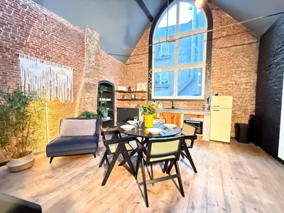 a kitchen and dining room with a table and chairs at NEW Central old town - Exclusive Residences in Antwerp