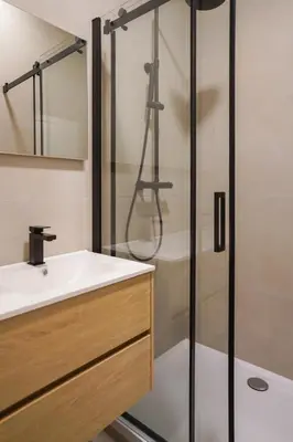 a bathroom with a sink and a shower at Appartment Jacobs 6 in Brussels
