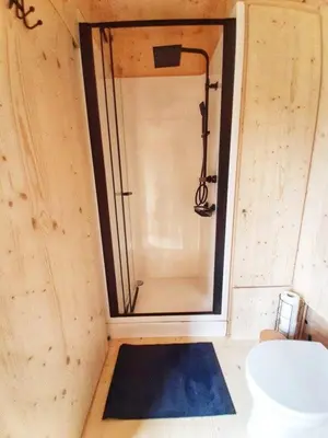 a shower in a small room with a toilet at Black Pearl in Hamme
