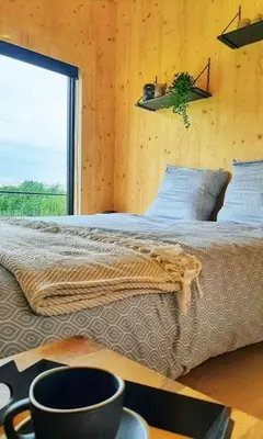 a bedroom with a bed with a large window at Black Pearl in Hamme