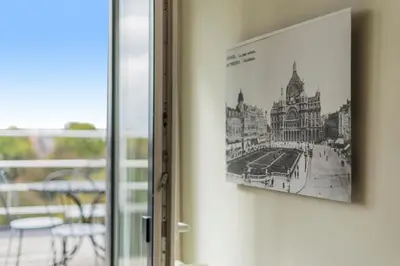a picture hanging on a wall next to a window at Fuths Penthouse 55 in Antwerp