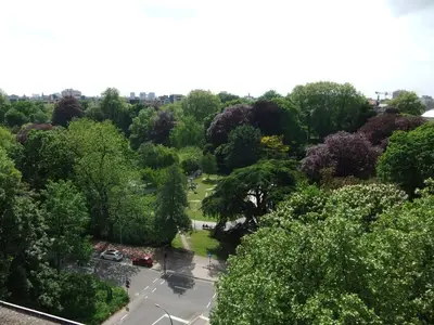 an overhead view of a park with trees and a parking lot at Fuths Penthouse 55 in Antwerp