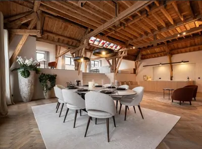 a dining room with a table and chairs at Luxury Designer Penthouse with Roof Terrace in Antwerp