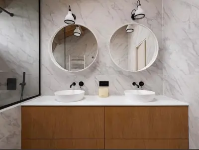 a bathroom with two sinks and two mirrors at Luxury Designer Penthouse with Roof Terrace in Antwerp