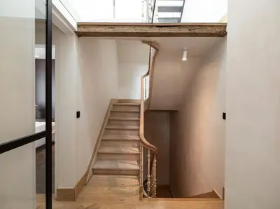 a staircase in a house with a skylight at Luxury Designer Penthouse with Roof Terrace in Antwerp