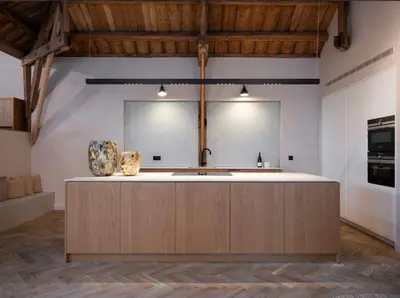 a kitchen with a large island in a room at Luxury Designer Penthouse with Roof Terrace in Antwerp