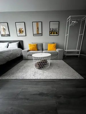 a living room with a couch and a table at Loft Tarantino au cœur de Bruxelles in Brussels
