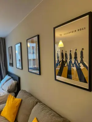 a framed picture of aitzomy dogs on a wall at Loft Tarantino au cœur de Bruxelles in Brussels