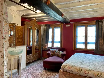 a bedroom with a bed and a sink and a mirror at House Le Prince D'Anvers in Antwerp