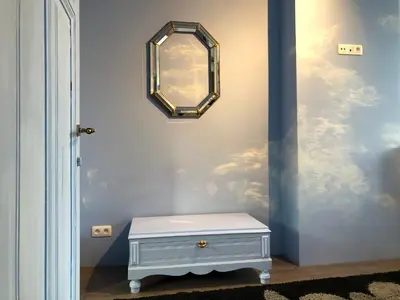 a room with a mirror and a white table at House Le Prince D'Anvers in Antwerp