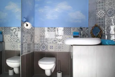 a bathroom with two toilets and a sink at House Le Prince D'Anvers in Antwerp