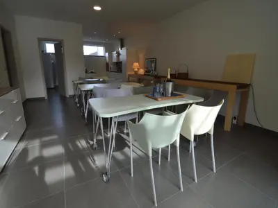 a dining room with white tables and white chairs at Holiday home in Zottegem in Zottegem