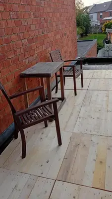 two picnic tables and a bench on a wooden deck at Lieria in Lier