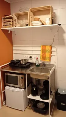 a small kitchen with a sink and a microwave at Lieria in Lier