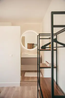 a room with a mirror and a shelf at Villa Paulette
