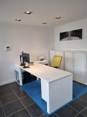 an office with a white desk with a computer on it at Le Jardin in Wommelgem
