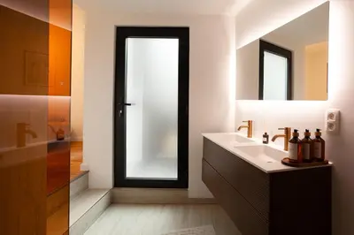 a bathroom with a sink and a mirror at Stylish 1BR Apartment near Zuid in Antwerp