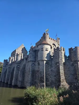 a castle on top of a body of water at Strole's House in Ghent